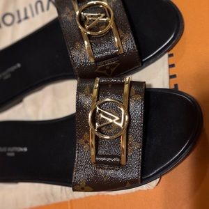 Louis Vuitton Lock it Flat Mule In brown
